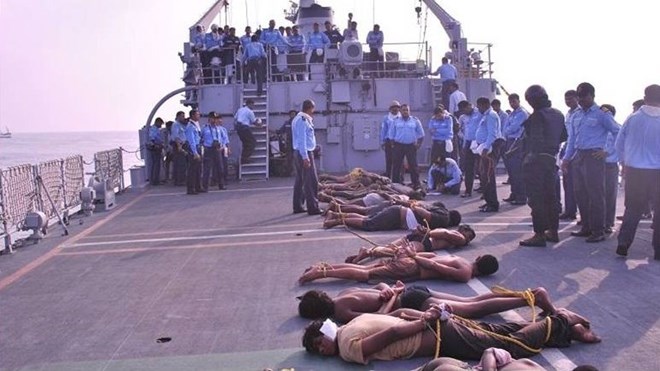 Sailors on the INS Tir arrest the pirate crew of the Prantalay 11 (file image, 2011)